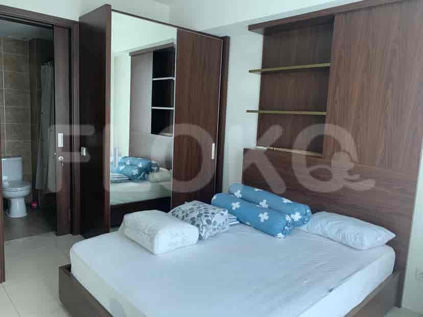 Bedroom with a bed, a wardrobe, and a private bathroom.