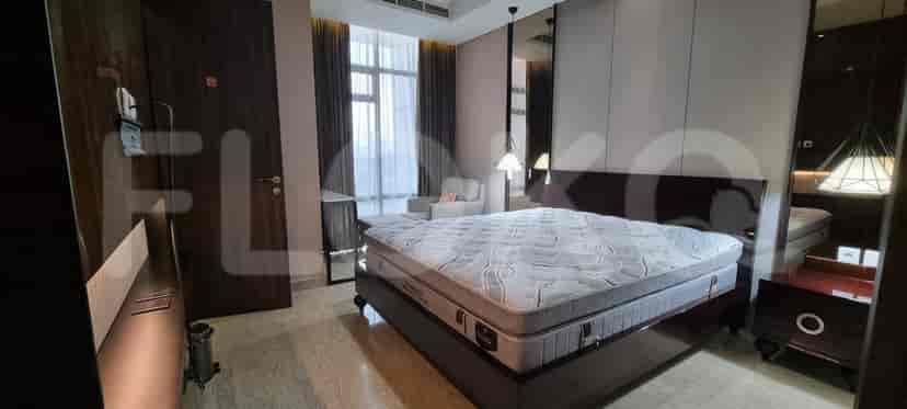 A bedroom with a king-size bed.