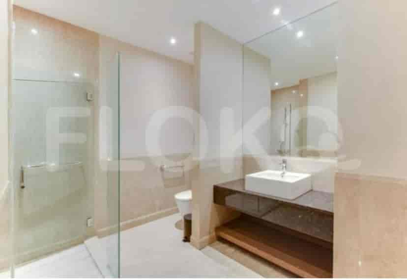 A modern bathroom with a glass shower.