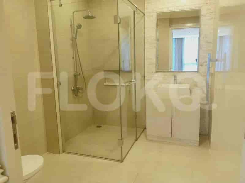 Bathroom with a walk-in shower, sink, and mirror.