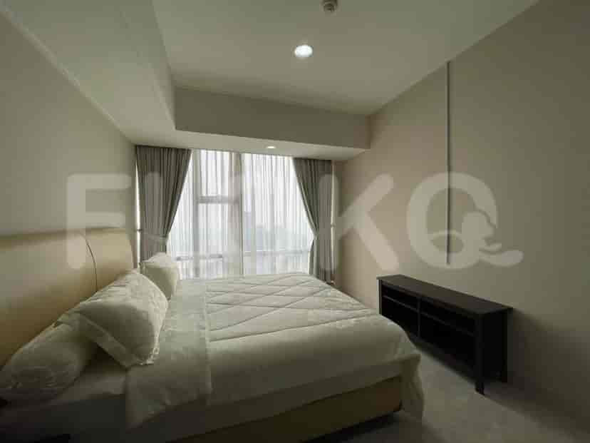 A bedroom with a double bed, curtains, and a marble floor.