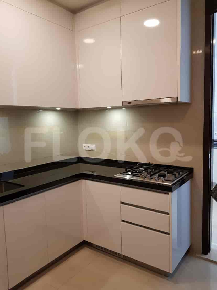 A modern kitchen with white cabinetry and a gas stove.