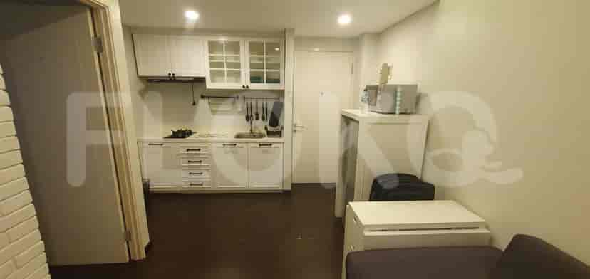 A small, well-equipped kitchen with white cabinets and appliances.