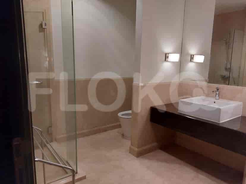 Bathroom with a glass shower, sink, and toilet.
