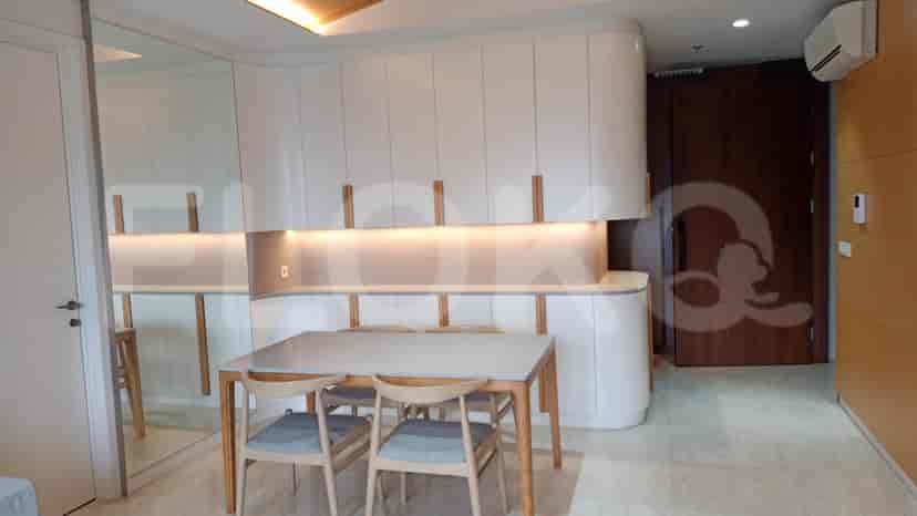 A modern dining area with a table and chairs.