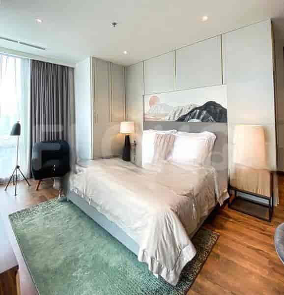 A stylish bedroom with a king-sized bed and modern decor.