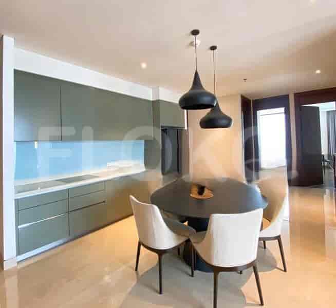 A modern kitchen with a dining area and stylish design.