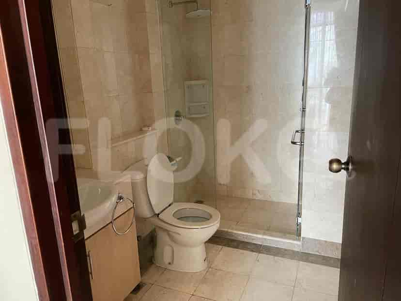 Modern bathroom with a walk-in shower and toilet.