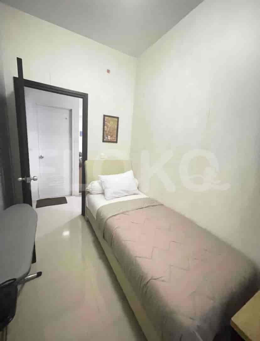 A small bedroom with a single bed.