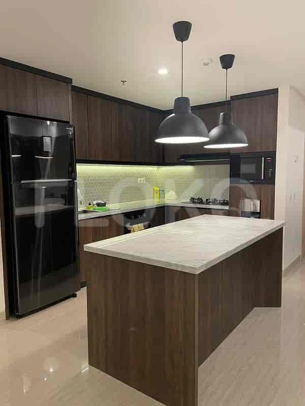 Modern kitchen with wooden cabinets, an island, and pendant lights.