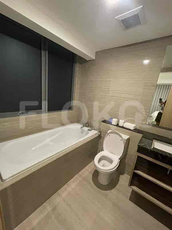 The bathroom includes a bathtub, a toilet, and a window.