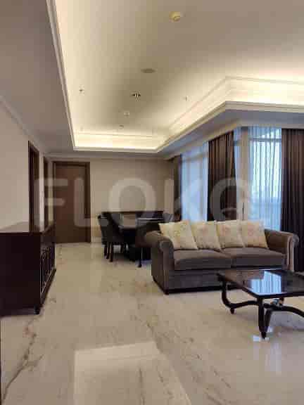 Spacious living area with marble floors, dining table, and comfortable seating.