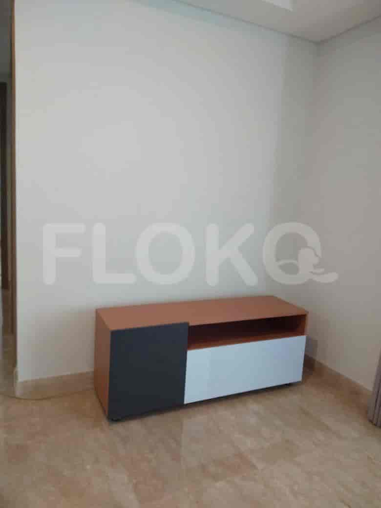 Low cabinet and plain walls.