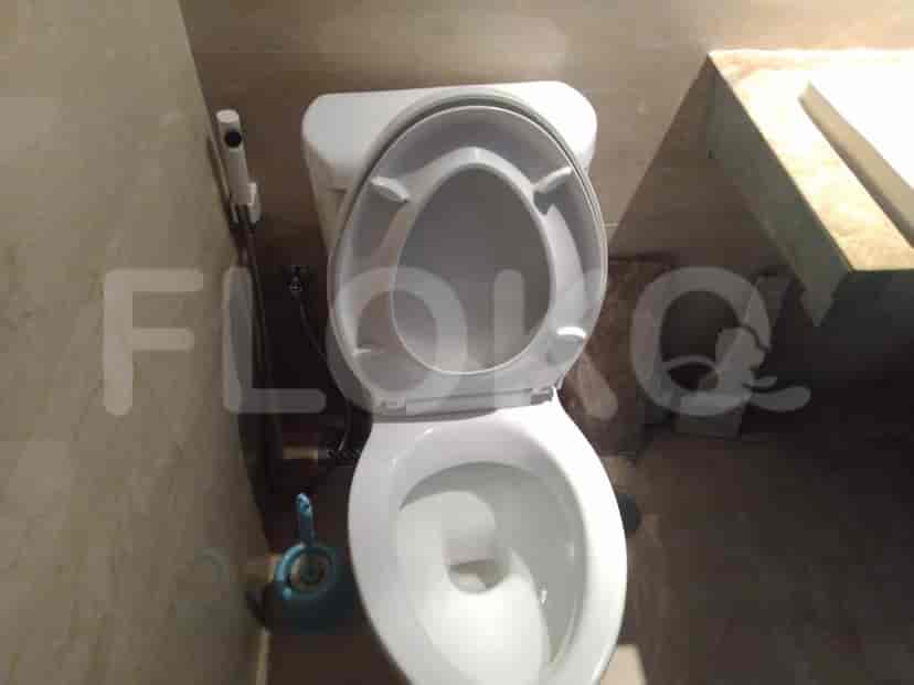 The bathroom showcasing the toilet.