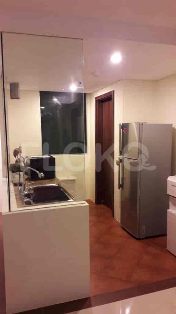 Kitchen area with cabinets and appliances.