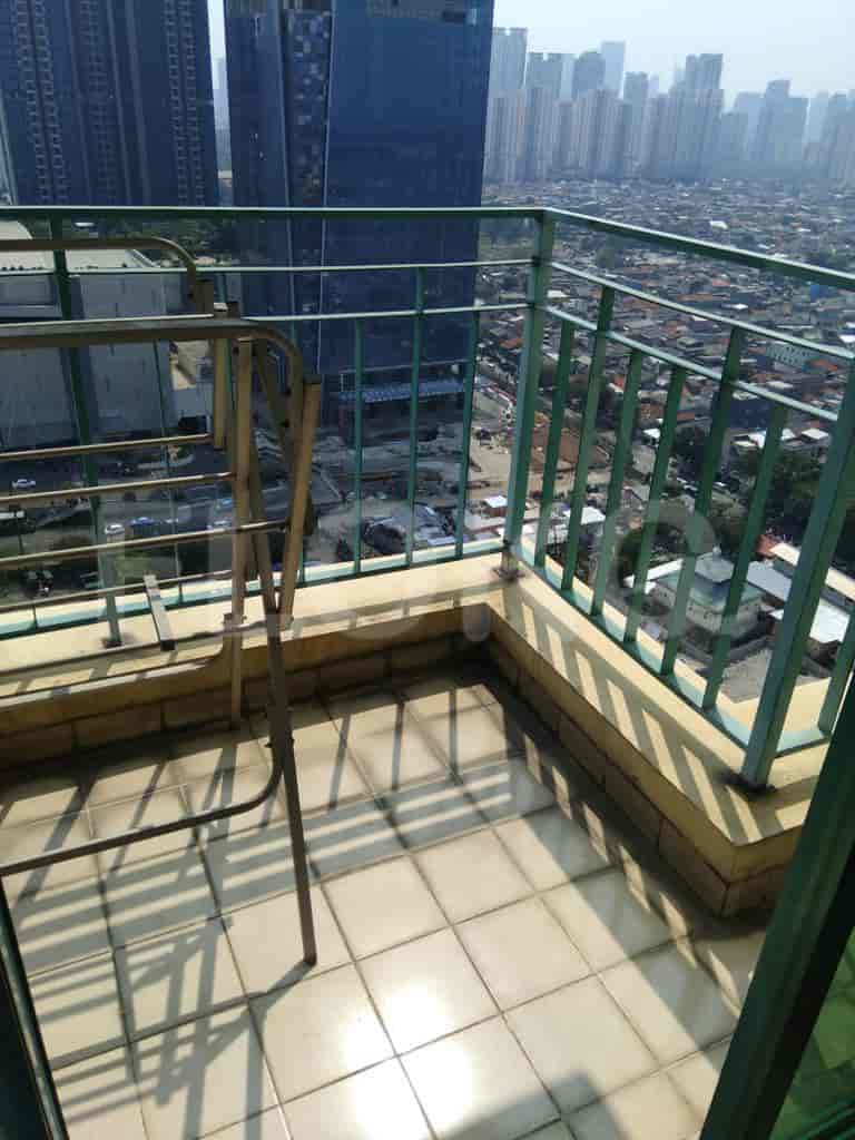 A balcony with a view of the city.