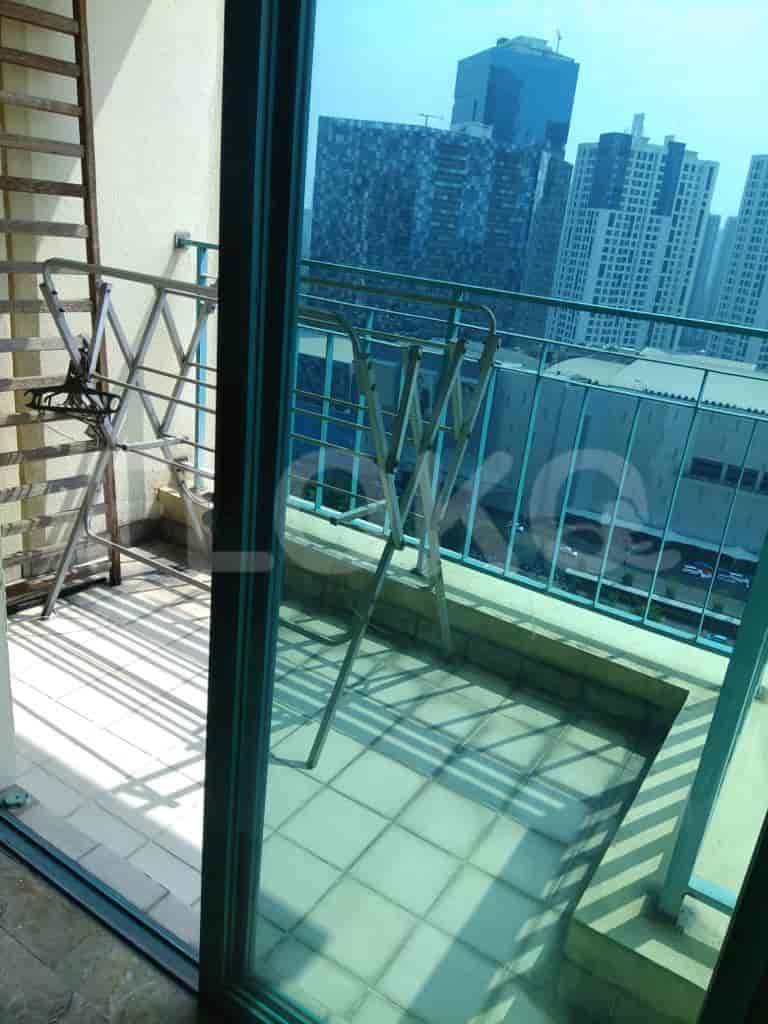 A balcony with a view of the city.