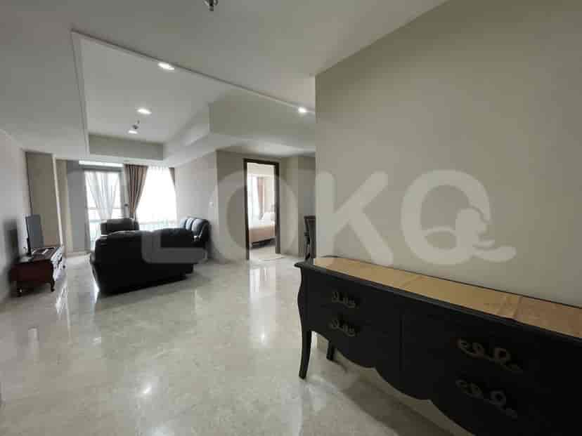 Living room or entryway, featuring a decorative console table and access to different rooms.