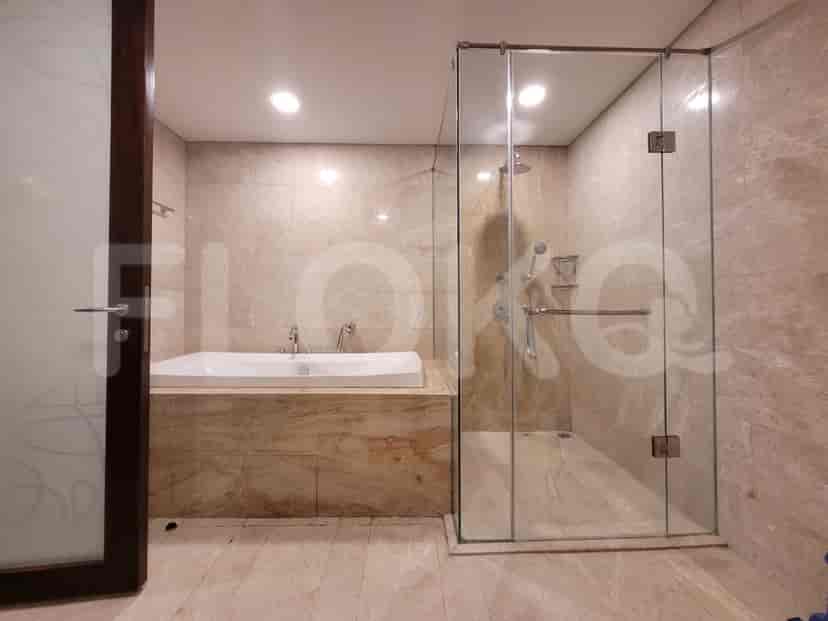 A luxurious bathroom with a bathtub and a separate shower area.