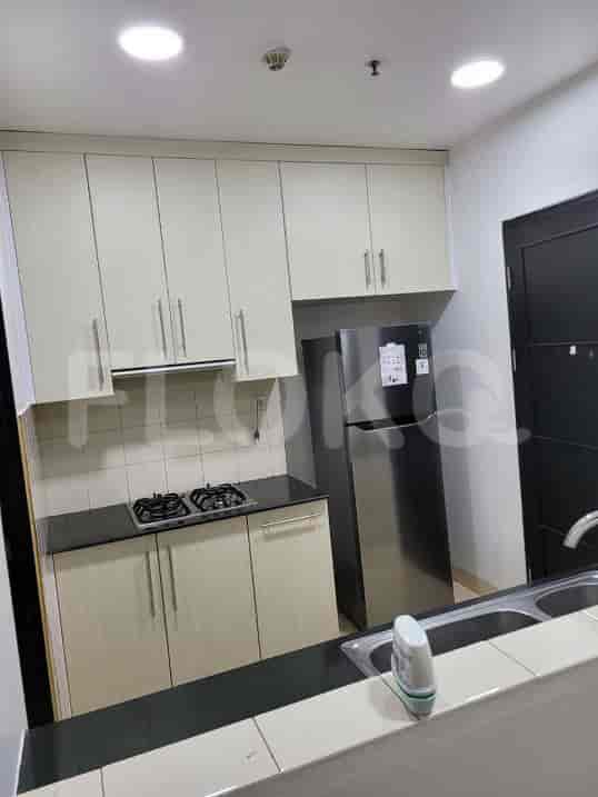 A compact, well-equipped kitchen with modern appliances and ample storage.