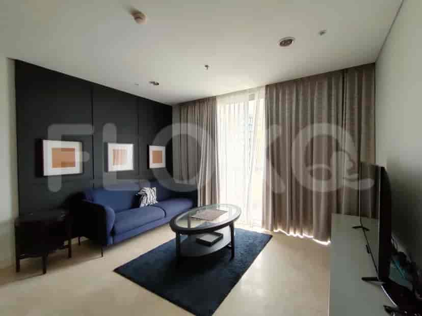 A master bedroom with a queen-size bed, bedside tables, and a dresser.