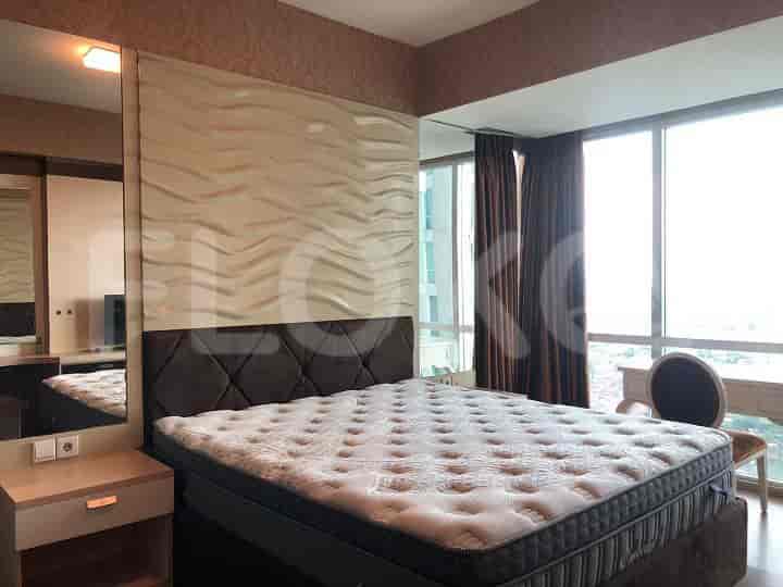 Bedroom with a double bed, mirrored wardrobe, and city view.