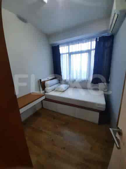 Another view of a bedroom with a bed and a desk area.