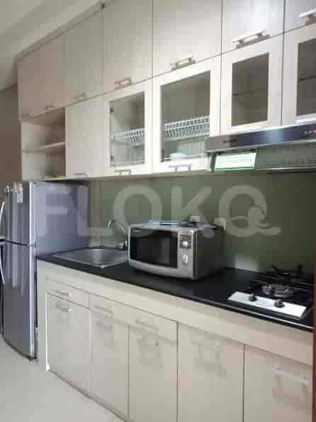 A kitchen with cabinets, appliances, and a stove.