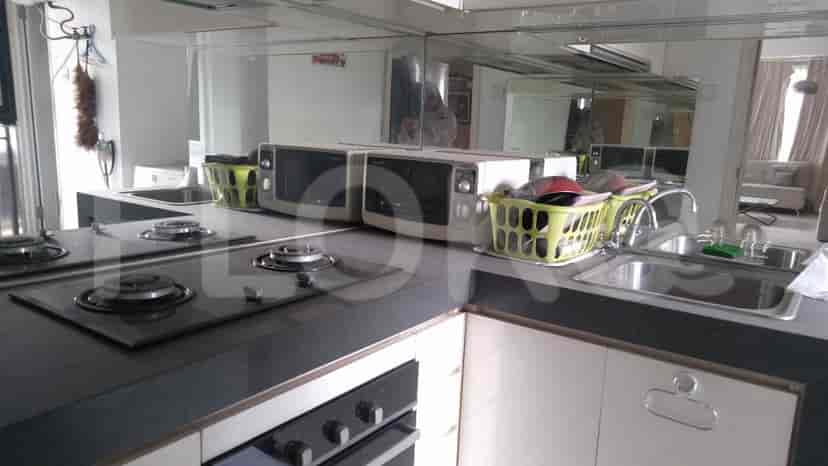 Modern kitchen with stove and microwave.