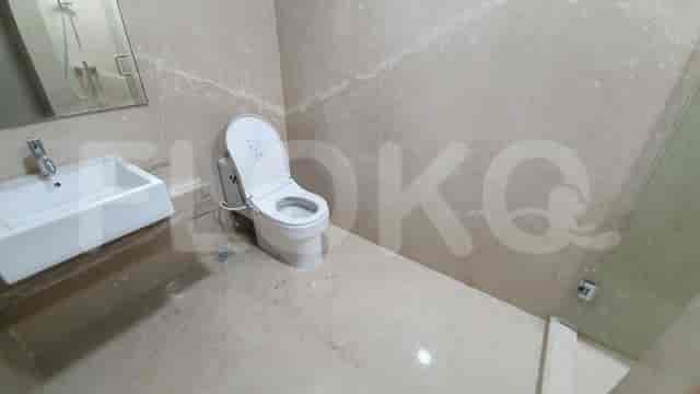A modern bathroom with a toilet and a sink.