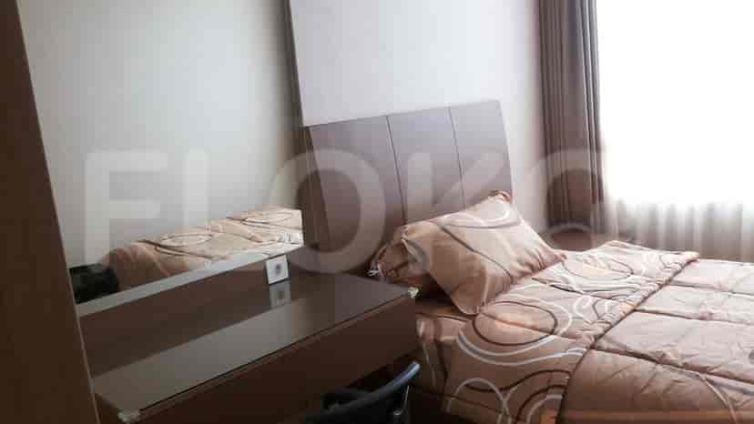 Bedroom with bed and dressing table.