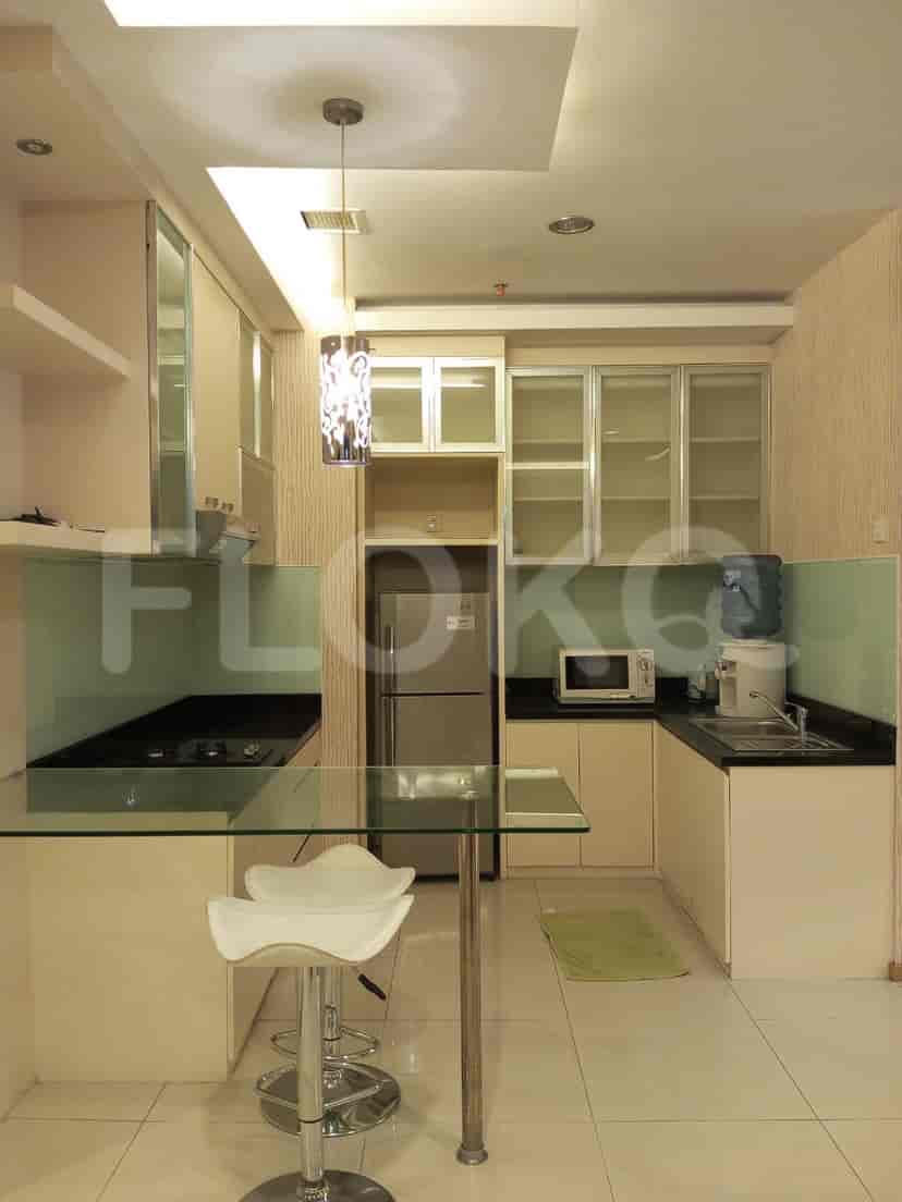 Small, modern kitchen with stainless steel appliances.