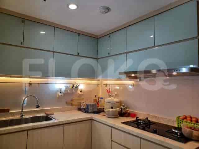 Kitchen featuring overhead cabinets, a countertop, and cooking appliances.