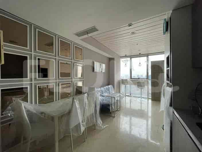 Living area with bar-style seating and a mirror wall.