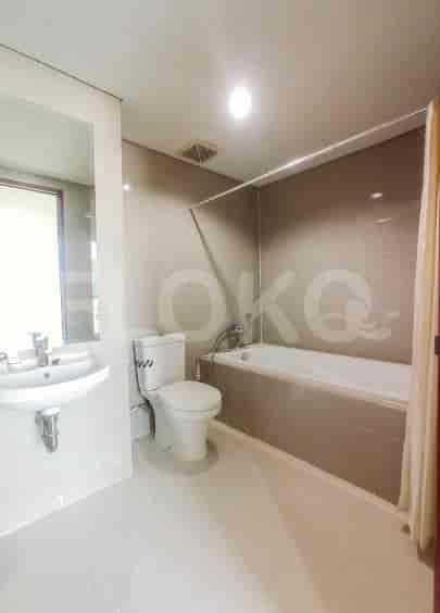 A bathroom featuring a bathtub, a toilet, and a sink.