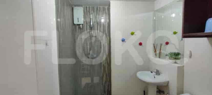 Bathroom with shower area and sink.