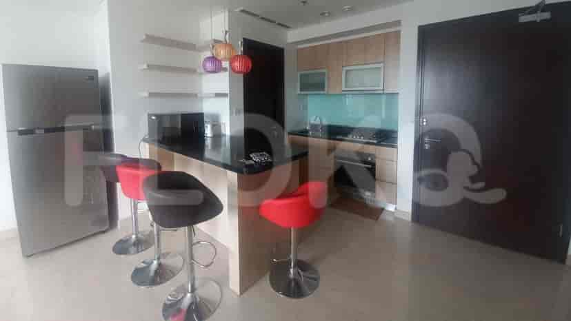 Modern kitchen with stainless steel appliances and a breakfast bar.