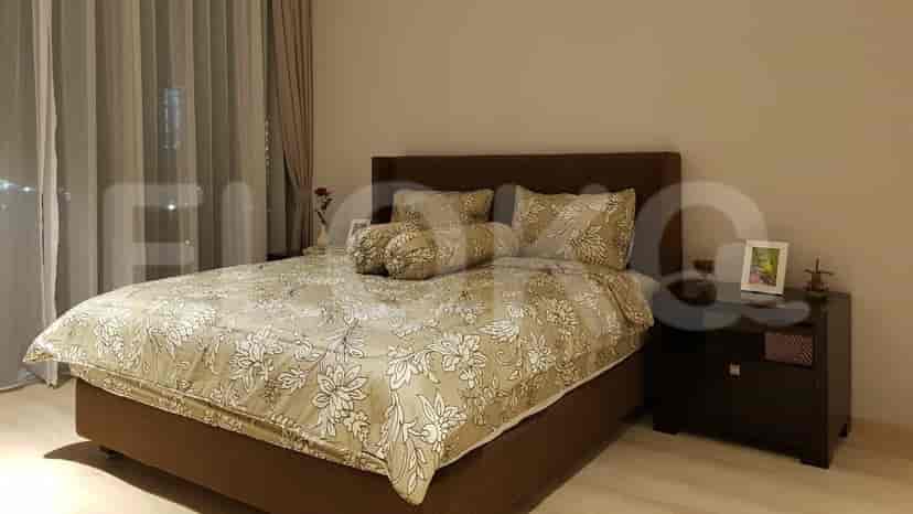 A cozy bedroom featuring a double bed, nightstands, and decorative accents.
