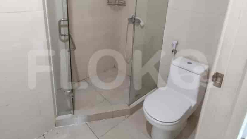 A shower with glass doors.