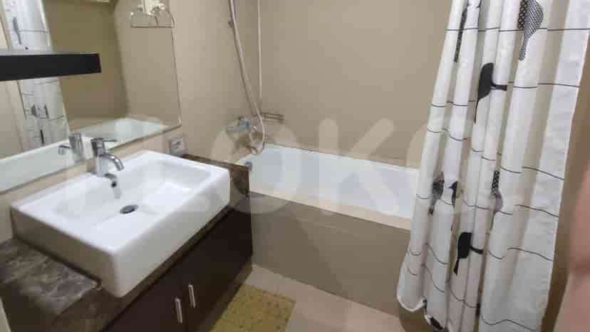 A bathroom with a bathtub and a shower.