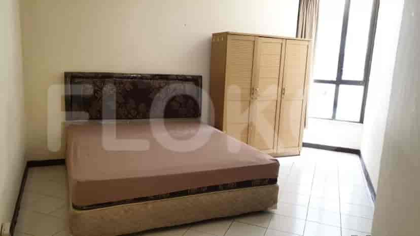 Bedroom with bed and wardrobe.