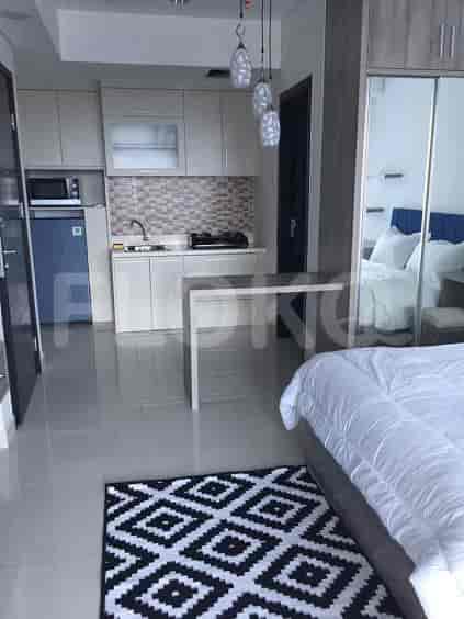 An open concept kitchen with a compact design, including a small breakfast bar.