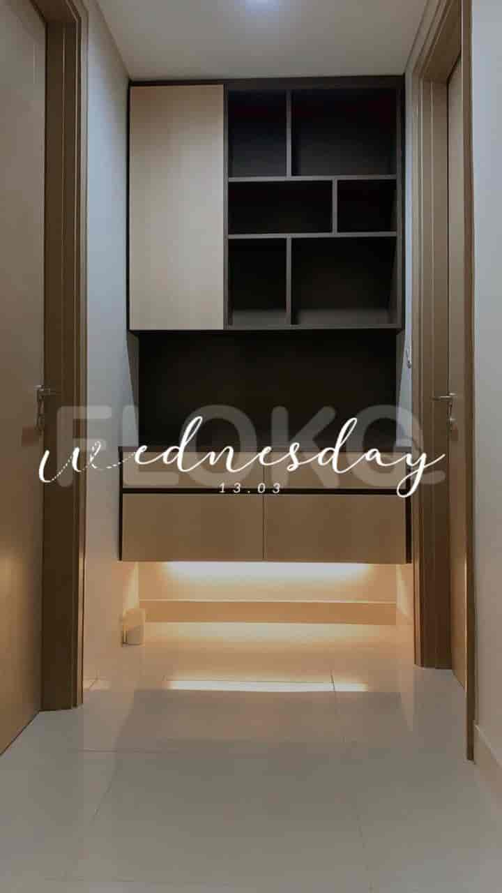 Hallway showing cabinets and storage with lights.
