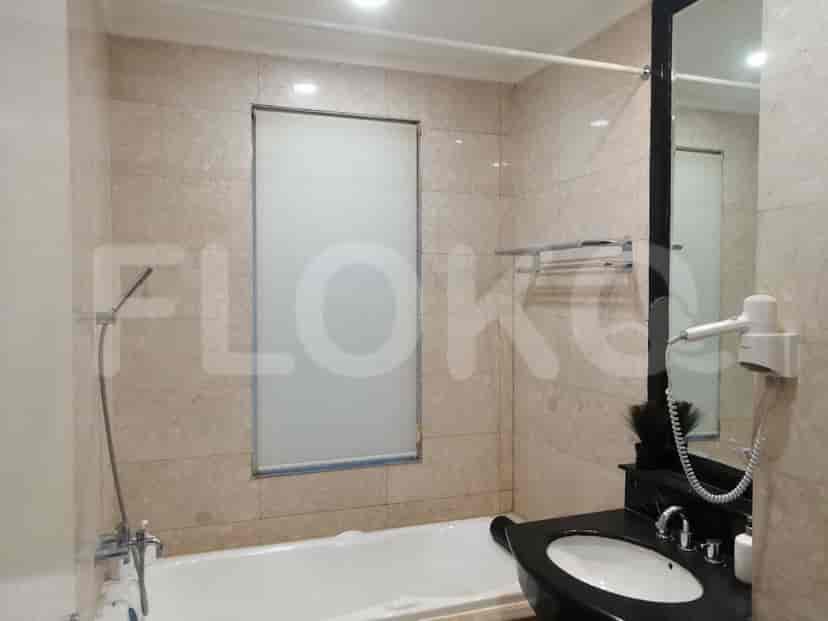 Bathroom featuring a bathtub, shower, and black sink.