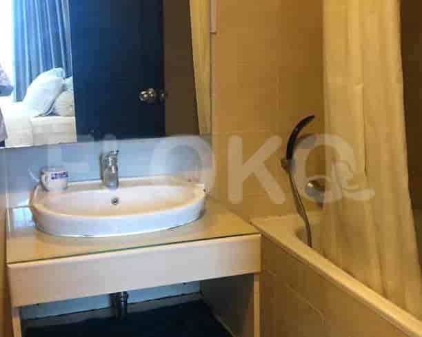 A bathroom with a bathtub and sink.