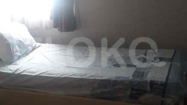 Another bedroom with a single bed and a window.