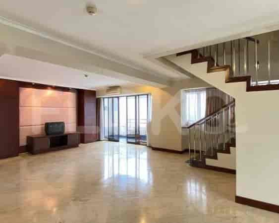 Open area with staircase and access to balcony.