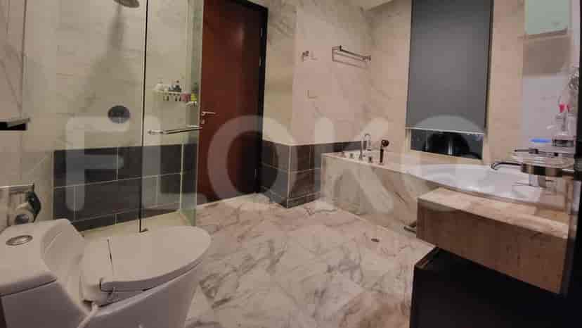 Luxurious bathroom with a bathtub, shower, and toilet.