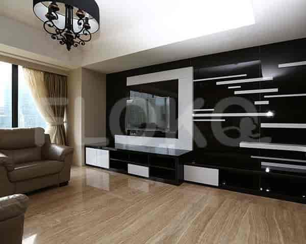 Modern living room with a black TV wall unit.