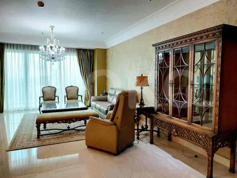 Living room with sofa, chairs, and cabinet.